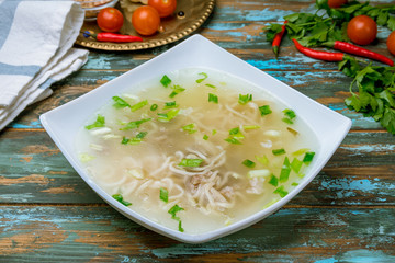 lamb noodle soup on wooden table