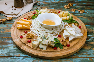 Cheese plate italian food on wooden table