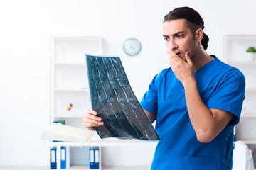 Young male doctor working in the clinic