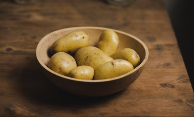 Raw organic potatoes in a bowl, part of a healthy diet