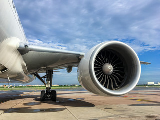 Jet engine of aircraft at airport with blue sky background,aviation industrial and  transportation.