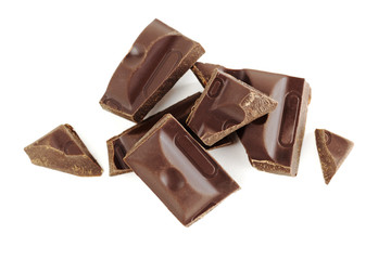 Fragments of dark chocolate isolated on white background. Broken the dark chocolate on small piece.