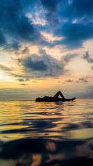 woman sunset infinity pool