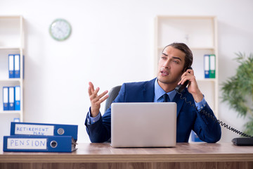 Young male accountant working in the office