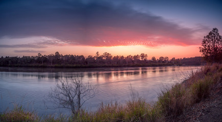 Obraz premium Panoramic Sunrise Over River