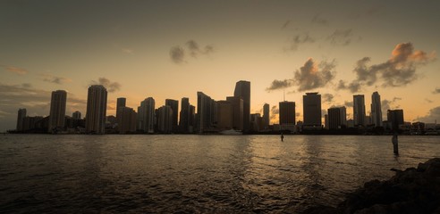 buildings view sea sky clouds lights water sunset miami