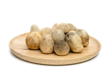 Straw mushroom on wooden dish,isolated on white background