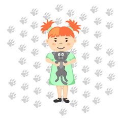 Little girl holding kitten. 