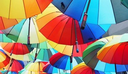 close-up of colorful umbrella, background with rainbow color red, blue, green, yellow, and orange