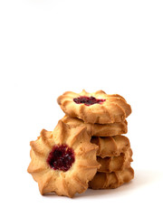 Traditional shotrbread cookies with jam on white background.