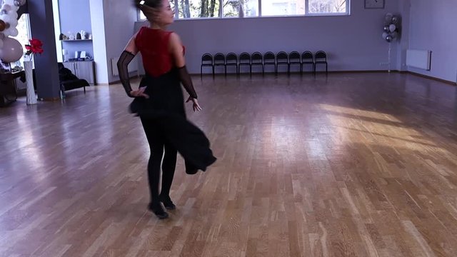Slow motion professional and passionate female dancer does a flip over on her hands