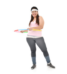 Fototapeta na wymiar Overweight Asian woman exercising with a hula-hoop isolated on white background..