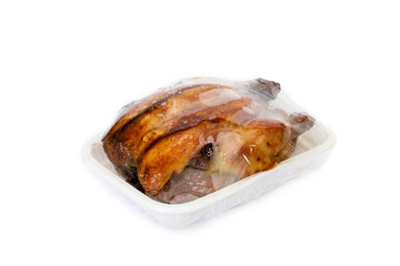 roasting chicken in plastic packaging,isolated on white background