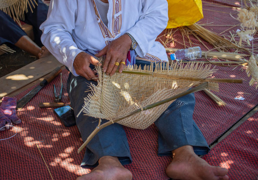 Handmade crafts of craftsman working basketry.