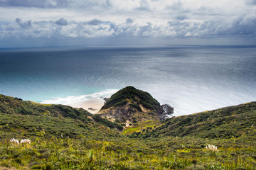 landscape with mountains and clouds and beach 