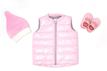 pink quilted jacket, boots and hat for babies. View from above. horizontal image