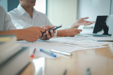 user experience UX designer designing web on smart phone layout. UI developer planning working on...