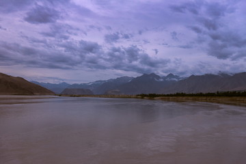 landscape view of the Indus river flowing through Katpana cold desert in Skardu, Gilgit Baltistan, Pakistan.