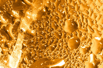 Drops of water on a gold background