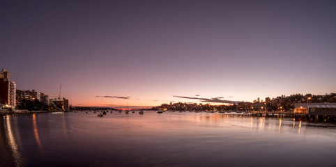 apartments and boats on the bay at dawn