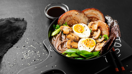 Traditional Japanese soup ramen with meat broth, asian noodles, sliced pork and eggs . Asian style food.