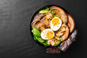Traditional Japanese soup ramen with meat broth, asian noodles, sliced pork and eggs . Asian style food.