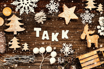 Letters Building The Word Takk Means Thank You. Wooden Christmas Decoration Like Tree, Sled And Star. Brown Wooden Background With Snowflakes
