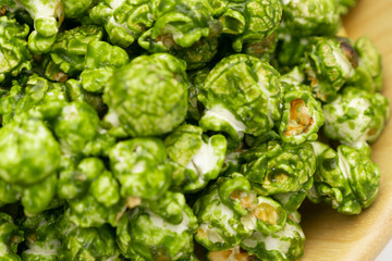 Lush of Japanese matcha green tea popcorn for texture background, Popular snack with favorite movie