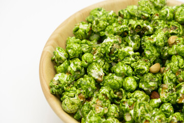 Top view the lush of Japanese matcha green tea popcorn with white background for copy space text, Popular snack with favorite movie