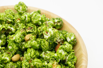 Top view the lush of Japanese matcha green tea popcorn with white background for copy space text, Popular snack with favorite movie