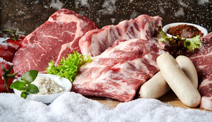 Assortment of fresh raw meat for a winter barbecue