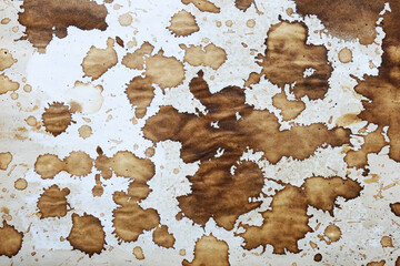 Brown coffee stains on paper background