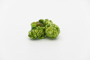 Lush of Japanese matcha green tea popcorn isolated on white background, Popular snack with favorite movie