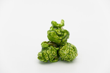 Obraz premium Lush of Japanese matcha green tea popcorn isolated on white background, Popular snack with favorite movie