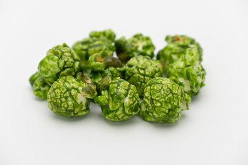 Lush of Japanese matcha green tea popcorn isolated on white background, Popular snack with favorite movie