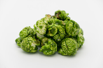 Lush of Japanese matcha green tea popcorn isolated on white background, Popular snack with favorite movie