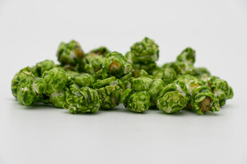 Lush of Japanese matcha green tea popcorn isolated on white background, Popular snack with favorite movie