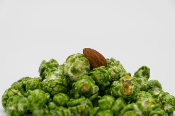 Lush of Japanese matcha green tea popcorn isolated on white background, Popular snack with favorite movie