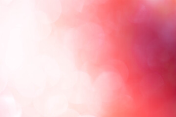 Bokeh blurry image on orange, white and pink background.