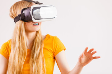 Girl wearing virtual reality goggles.