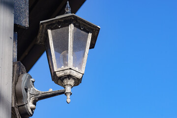 Old lamp on wall, street lantern outdoor