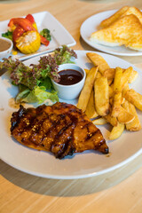 Teriyaki chicken steak with fresh salad and fried potato