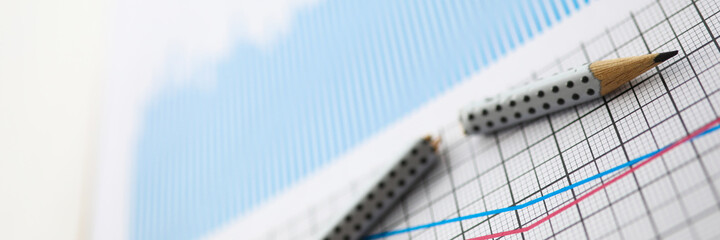 Broken pencil lies on table against background
