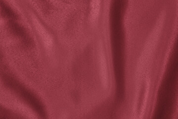Dark red colored Background of soft draped fabric. Beautiful satin silk textured cloth for making...