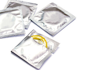 Condom in seal package and opened isolate on white background.