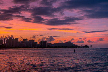 Sunrise at Ala Moana Beach Park with Paddleboarders in Oahu, Hawaii