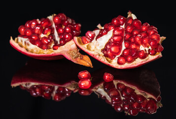 ripe pomegranate fruit with reflection