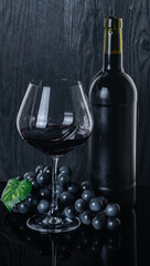 bottle and glass with red wine