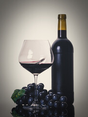 bottle and glass with red wine