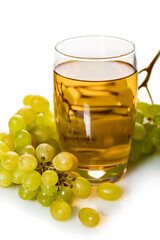 glass of grape juice with bunch of ripe green grapes
